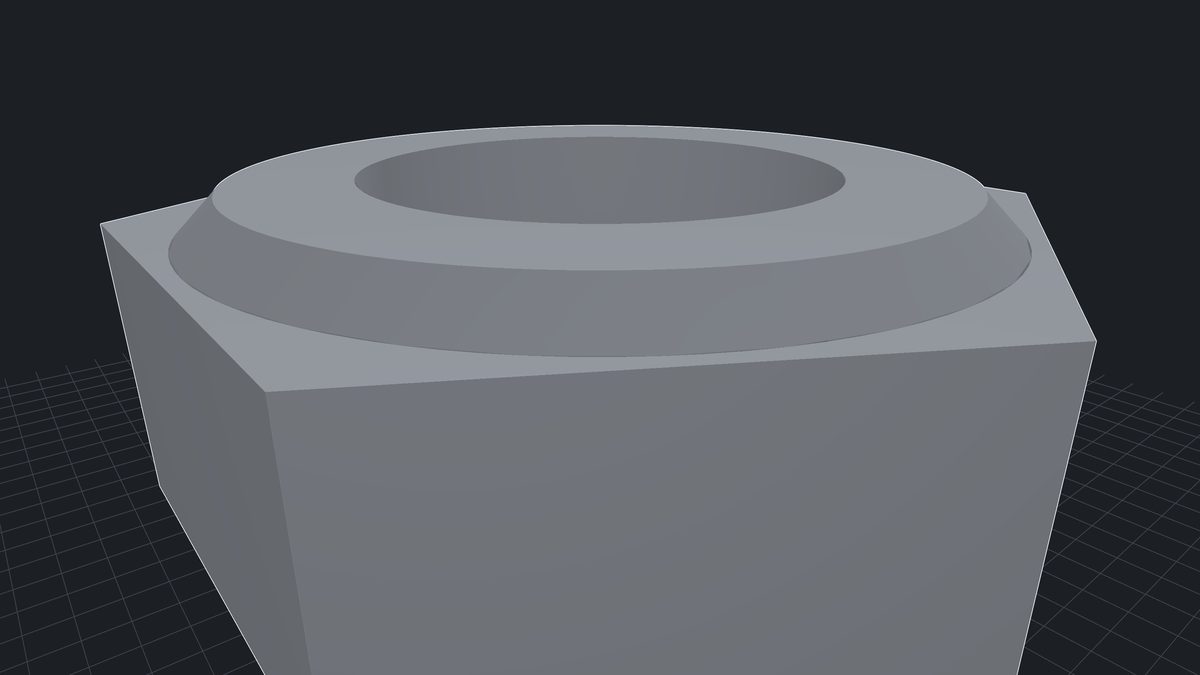 The nut close in: its bore and chamfer drawn as exact surfaces